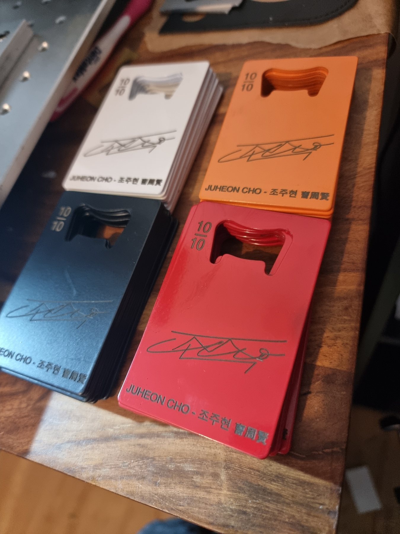 Stacks of personalised coloured metal opener cards