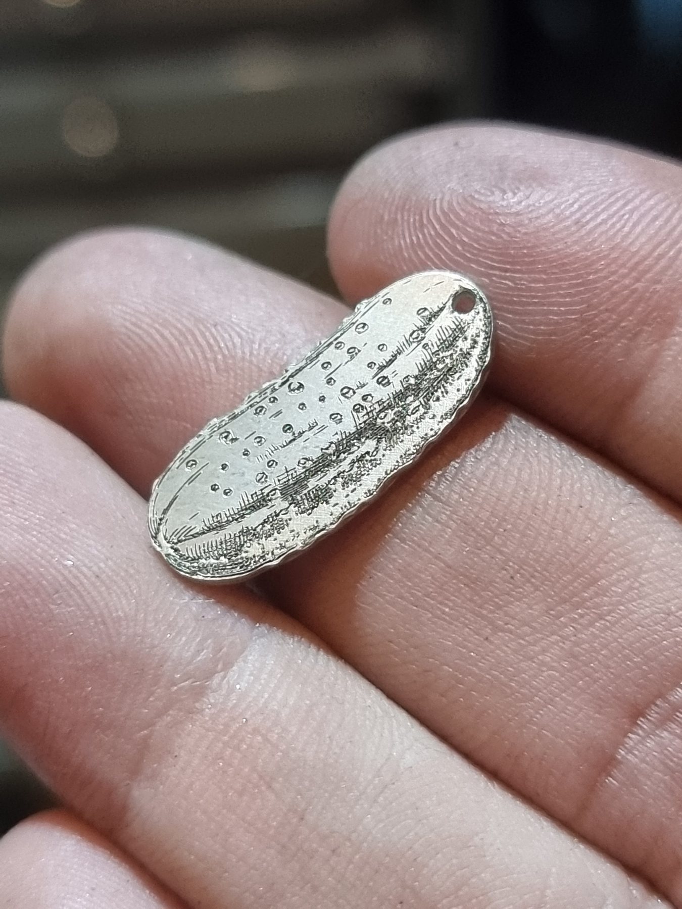 Sterling silver pendant with a detailed landscape engraving